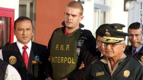 Joran van der Sloot, center, is escorted by Peruvian police June 4, 2010, after Chilean authorities handed him over.