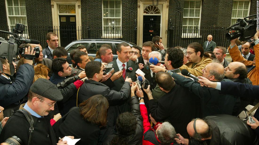 Erdogan is surrounded by journalists outside 10 Downing Street in London in November 2002. Erdogan had been attending talks with British Prime Minister Tony Blair.