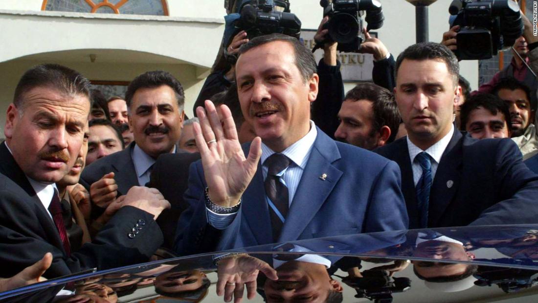 Erdogan waves to supporters after Friday prayers at the Mehmet Zahit Kotku Mosque in Ankara in November 2002. Erdogan&#39;s Justice and Development Party won the majority of seats in Turkey&#39;s parliamentary elections that month, and he would become prime minister in March 2003.