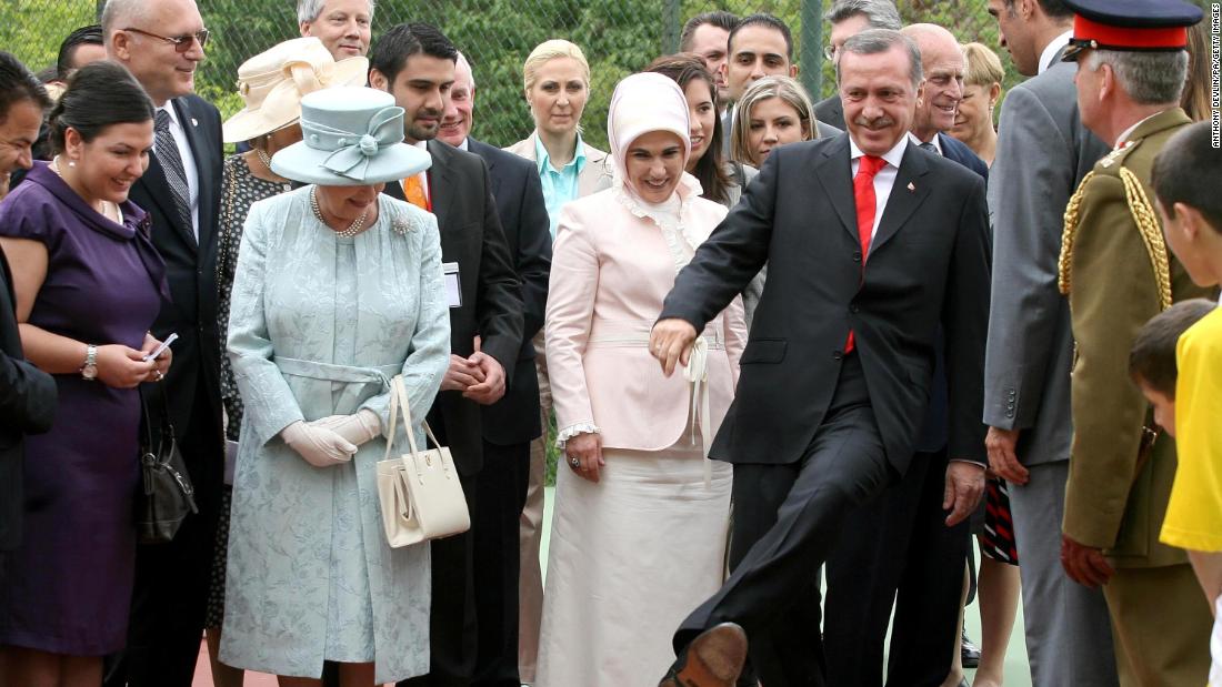 Britain&#39;s Queen Elizabeth II watches Erdogan kick a football during a royal garden party at the British Embassy in Ankara in 2008. It was the final day of the Queen&#39;s state visit to Turkey.