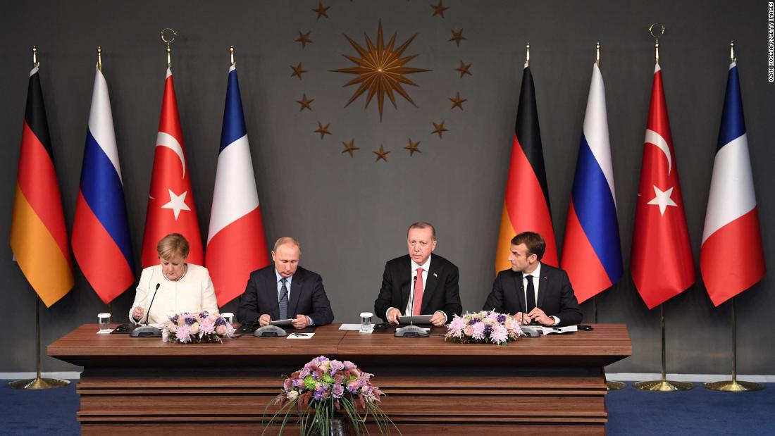 From left, German Chancellor Angela Merkel, Russian President Vladimir Putin, Erdogan and French President Emmanuel Macron take part in a summit in Istanbul that was called in October 2018 to find a lasting political solution to the civil war in Syria.