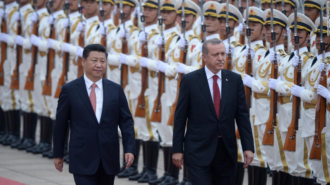 Erdogan and Chinese President Xi Jinping inspect honor guards during a welcome ceremony outside the Great Hall of the People in Beijing in July 2015.