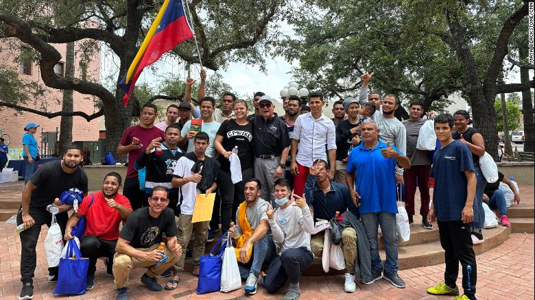 Pastor Carlos Navarro of Iglesia Batista West Brownsville poses with a group of Venezuelan migrants who&#39;ve just arrived in his city.
