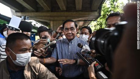 Thai Prime Minister and United Thai Nation Party&#39;s candidate Prayut Chan-o-Cha leaves after casting his ballot at a polling station in Bangkok on May 14, 2023.