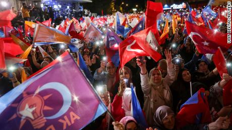 Supporters of Turkish President Tayyip Erdogan wave flags outside the AK Party headquarters in Ankara, Turkey, on May 15. Umit Bektas/Reuters