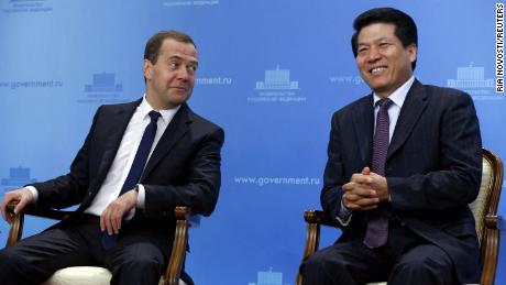 In this photo from 2015, Li Hui (right), now China&#39;s special representative for Eurasian affairs, sits with then-Russian Prime Minister Dmitry Medvedev at an event in Moscow. Li was China&#39;s ambassador to Russia from 2009-2019.