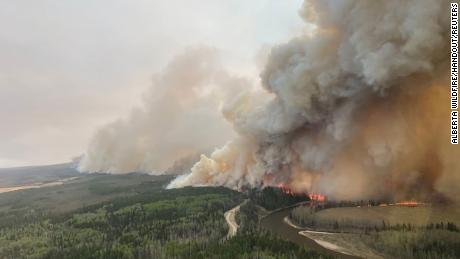 A smoke column rises from wildfire EWF-035 near Shining Bank, Alberta, Canada May 5, 2023.