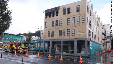 Damage is seen on a hostel building following a fatal fire in Wellington on May 16, 2023.