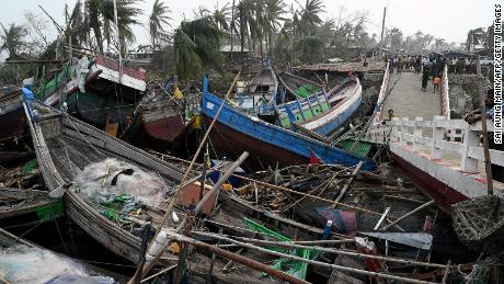 Broken boats are piled up next to a broken bridge in Sittwe, in Myanmar&#39;s Rakhine state, on May 15, 2023, after Cyclone Mocha made a landfall. 