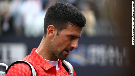Novak Djokovic leaves the court after losing his quarterfinal match against Denmark&#39;s Holger Rune.