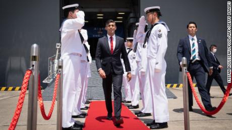 British Prime Minister Rishi Sunak leaves the Japanese aircraft carrier JS Izumo after a visit to the Japan Maritime Self-Defence Force (JMSF) at the Yokosuka Naval Base, Japan, on Thursday.