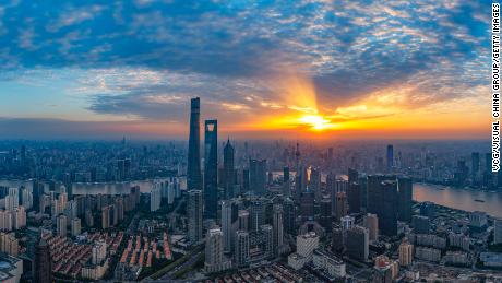 The sun sets over Shanghai&#39;s Lujiazui Financial District on May 8, 2023