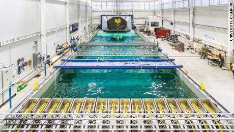 Engineers test a floating offshore wind model in the pool at the University of Maine&#39;s Advanced Structures and Composites Center, which is pioneering designs of floating turbines.