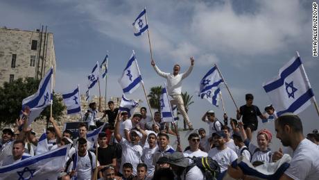 Israelis wave national flags during a march marking Jerusalem Day, just outside Jerusalem&#39;s Old City.