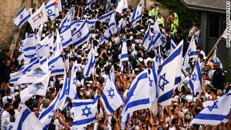 Israelis sing and dance with flags by Damascus gate to Jerusalem&#39;s Old city as they mark Jerusalem Day.