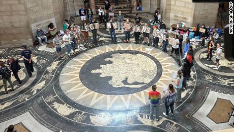 Protesters gather inside the State Capitol building on Friday, May 19, 2023, in Lincoln, Neb., before lawmakers were scheduled to begin debating a bill that will ban abortions at 12 weeks of pregnancy and also ban gender-affirming care for transgender minors. 