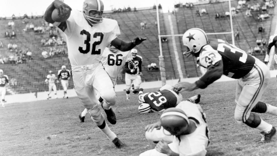 Brown runs during a game against Dallas in 1960. He led the league in rushing in eight of his nine seasons and was named MVP in 1957, 1958 and 1965.