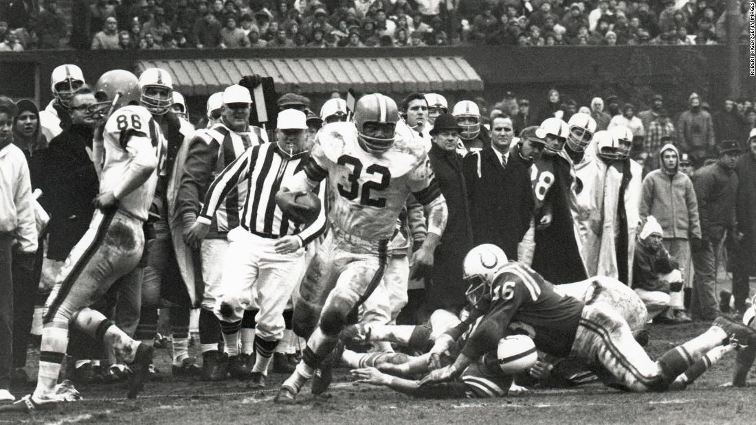 Brown rumbles down the sideline during the NFL Championship Game in December 1964. The Browns smashed the Baltimore Colts 27-0.