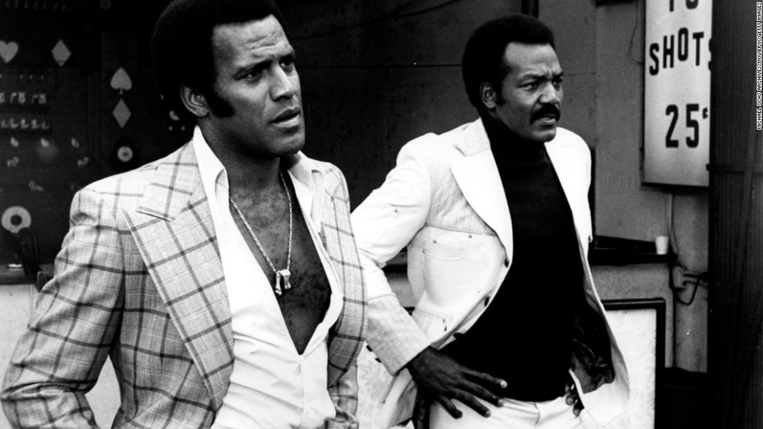 Brown, right, and Fred Williamson star in the 1974 film &quot;Three the Hard Way.&quot;