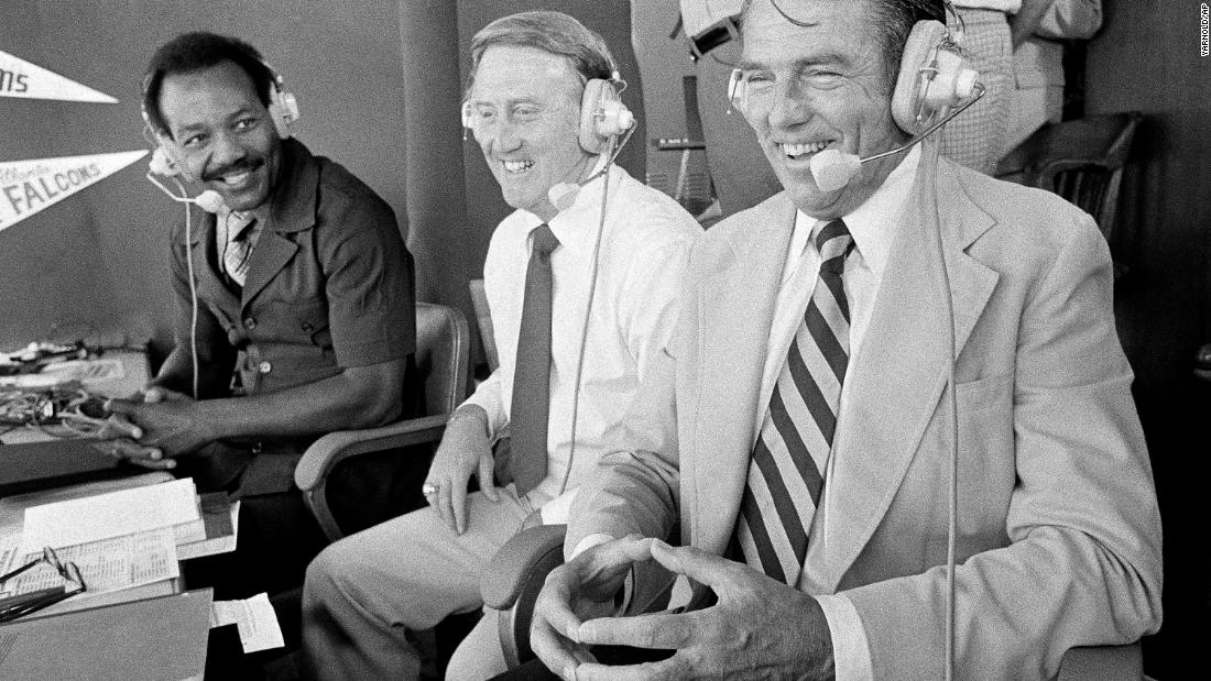 Brown joins Vin Scully, center, and George Allen while commentating on an NFL game in Los Angeles in 1978.