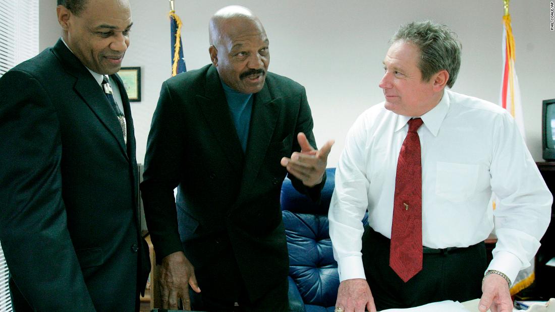 Brown talks with Florida Rep. Mitch Needelman, right, and Juvenile Justice Secretary Walt McNeil before meeting with the Florida House Committee on Juvenile Justice in 2007.   Brown addressed the committee regarding gang intervention and prevention.
