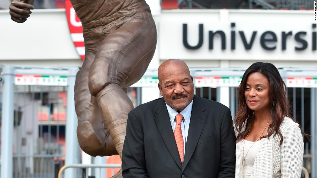 Brown and his wife, Monique, stand in front of his statue outside the Cleveland Browns&#39; stadium in 2016.