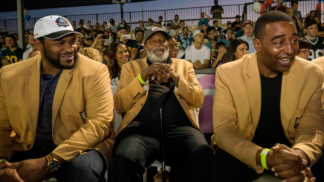 Brown, center, attends a football game in Israel along with NFL legends Jerome Bettis, left, and Cris Carter in 2017. Eighteen members of the Pro Football Hall of Fame were in the country to meet some of the 2,000 active players in Israel&#39;s various leagues.