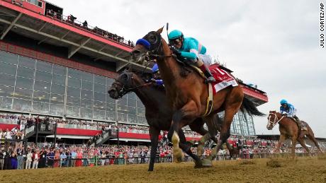 National Treasure, with jockey John Velazquez, edges out Blazing Sevens, with jockey Irad Ortiz Jr., to win the 148th running of the Preakness Stakes horse race at Pimlico Race Course, Saturday, May 20, 2023, in Baltimore. Kentucky Derby winner Mage, right, finished third.  (AP Photo/Julio Cortez)