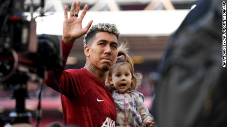 A tearful Roberto Firmino waves goodbye to the Kop End during his last match at Anfield. 