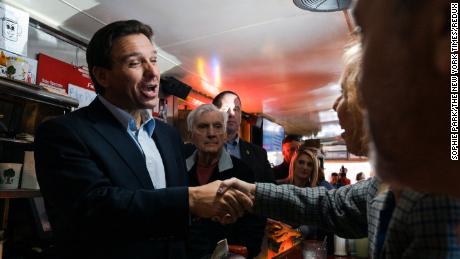 Florida Gov. Ron DeSantis greets people at a diner in Manchester, New Hampshire, on May 19, 2023.
