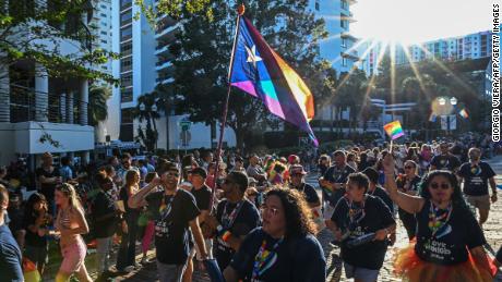 People attend a Pride Parade in Orlando, Florida, on October 15, 2022.