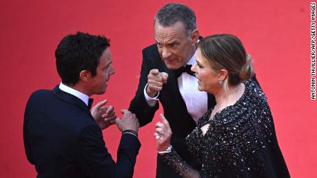 (From left) A Cannes Film Festival staff member, Tom Hanks and Rita Wilson at the premiere of &#39;Asteroid City&#39; on Tuesday in France. 