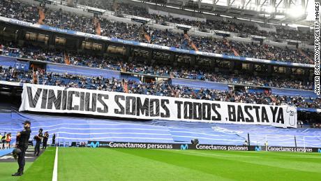 Real Madrid fans hold up a banner reading &quot;We&#39;re all Vinícius. Enough&quot; before the game against Rayo Vallecano.