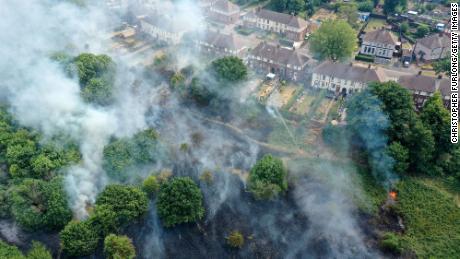 Firefighters contain a wildfire on July 20, 2022, in Sheffield, England. Multiple fires broke out across the UK during a record-breaking heatwave. 