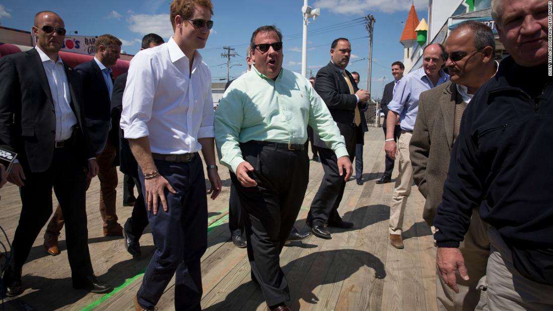 Christie walks with Britain&#39;s Prince Harry on the boardwalk in Seaside Heights, New Jersey, in May 2013. Harry was on a weeklong US tour.