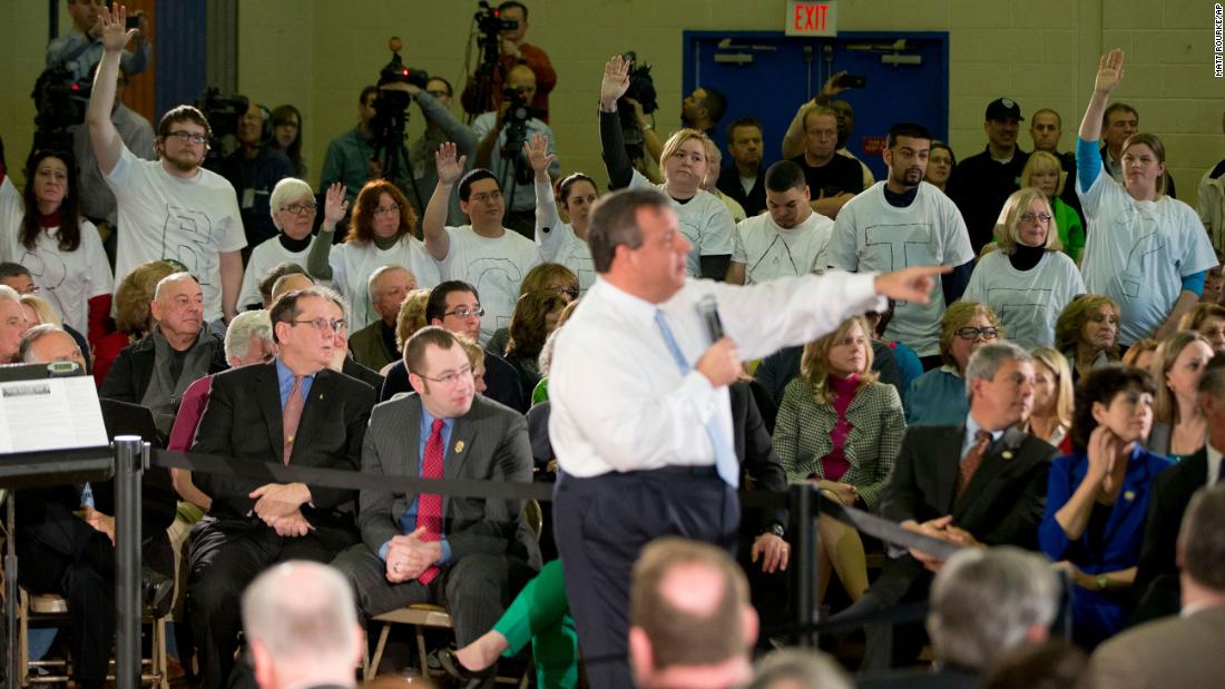 Demonstrators stand with the word &quot;Bridgegate&quot; spelled out on their shirts as Christie holds a town hall-style meeting in Flemington, New Jersey, in March 2014.