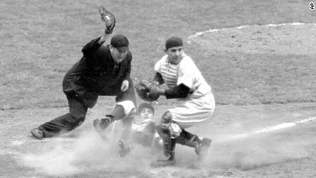 In this Oct. 6, 1950, file photo, Philadelphia Phillies shortstop Granny Hamner is tagged at the plate by New York Yankees catcher Yogi Berra as he tries to score from third in the ninth inning of Game 3 of the World Series, at Yankee Stadium in New York. The Yankees won 3-2.