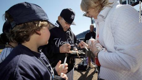 New York Yankees Hall of Fame catcher Yogi Berra signs autographs for special guests of the Yankees before team&#39;s spring training baseball game against the Toronto Blue Jays at Steinbrenner Field in Tampa, Fla., in March 2010.