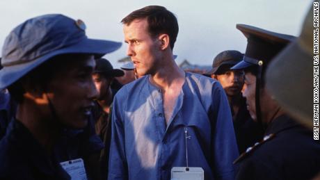 Ken Wallingford is seen in a group of Viet Cong and North Vietnamese Army personnel after his released at Loc Ninh, Vietnam, on February 12, 1973.
