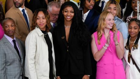 Angel Reese, center, stands with fellow LSU women&#39;s basketball team members during an event to honor the 2023 NCAA national champion LSU women&#39;s basketball team in the East Room of the White House, Friday, May 26, 2023, in Washington, DC. 