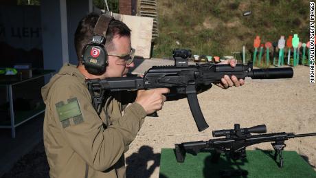 A man shoots an AK-12 Kalashnikov assault rifle ahead of an arms show in Russia in 2020.