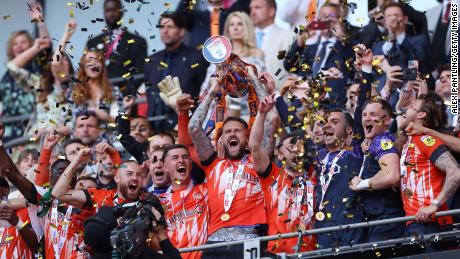 Luton Town players celebrate after the club returned to English football&#39;s top flight for the first time in 31 years.