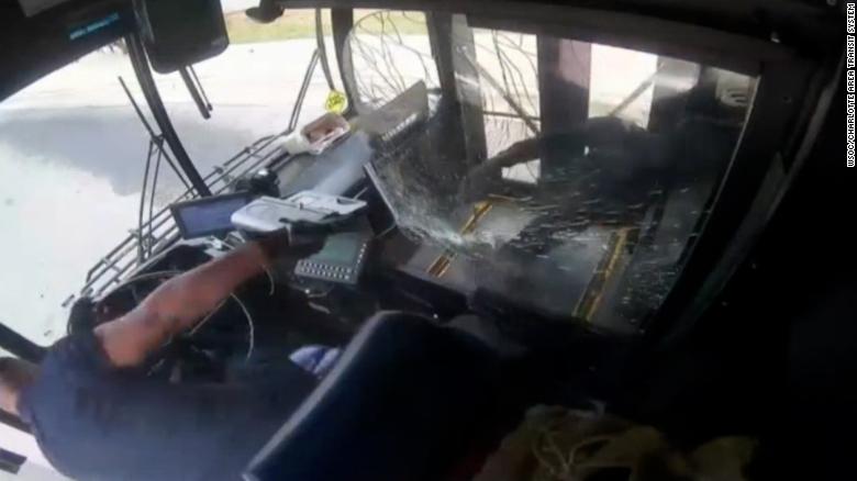 Surveillance footage shows bus driver and passenger in shootout aboard moving bus
