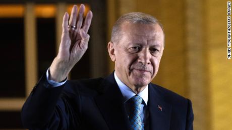 President Recep Tayyip Erdogan gestures to supporters at the presidential palace after winning the presidential runoff in Ankara, Turkey on Monday. 