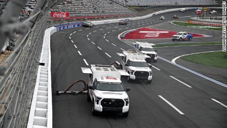 The Toyota Track Drying Team works on the track prior to the NASCAR Xfinity Series Alsco Uniforms 300 at Charlotte Motor Speedway on May 29, 2023, in Concord, North Carolina.