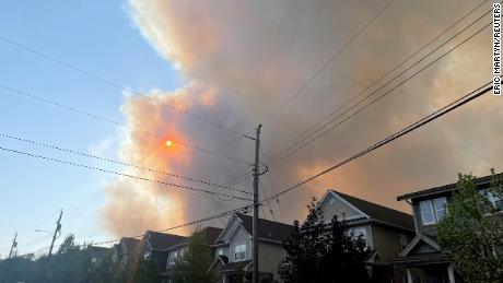 Smoke from the Tantallon wildfire rises over homes in nearby Bedford, Nova Scotia, Canada.
