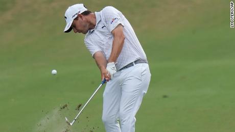 Grillo hits an approach shot during a playoff at the Charles Schwab Challenge.