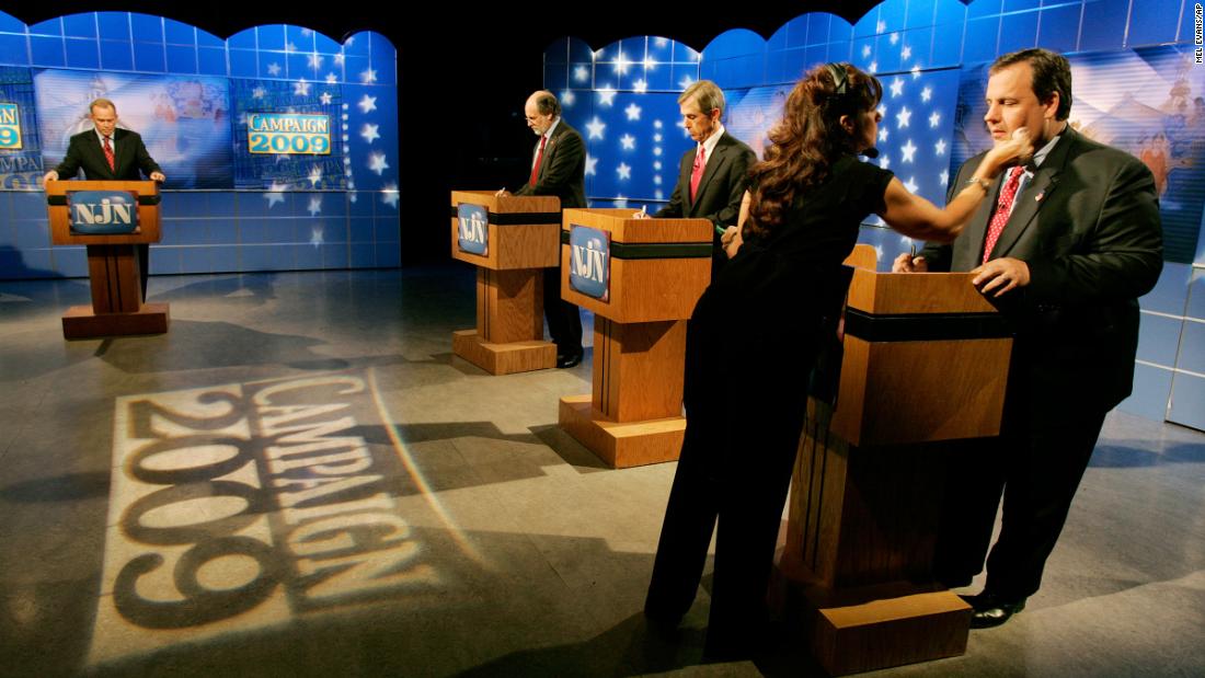 Christie has makeup applied before a gubernatorial debate with Chris Daggett, center, and New Jersey Gov. Jon Corzine in October 2009.