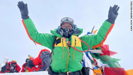 Kami Rita Sherpa, 53, pictured on the summit of Mount Everest on May 23, 2023.
