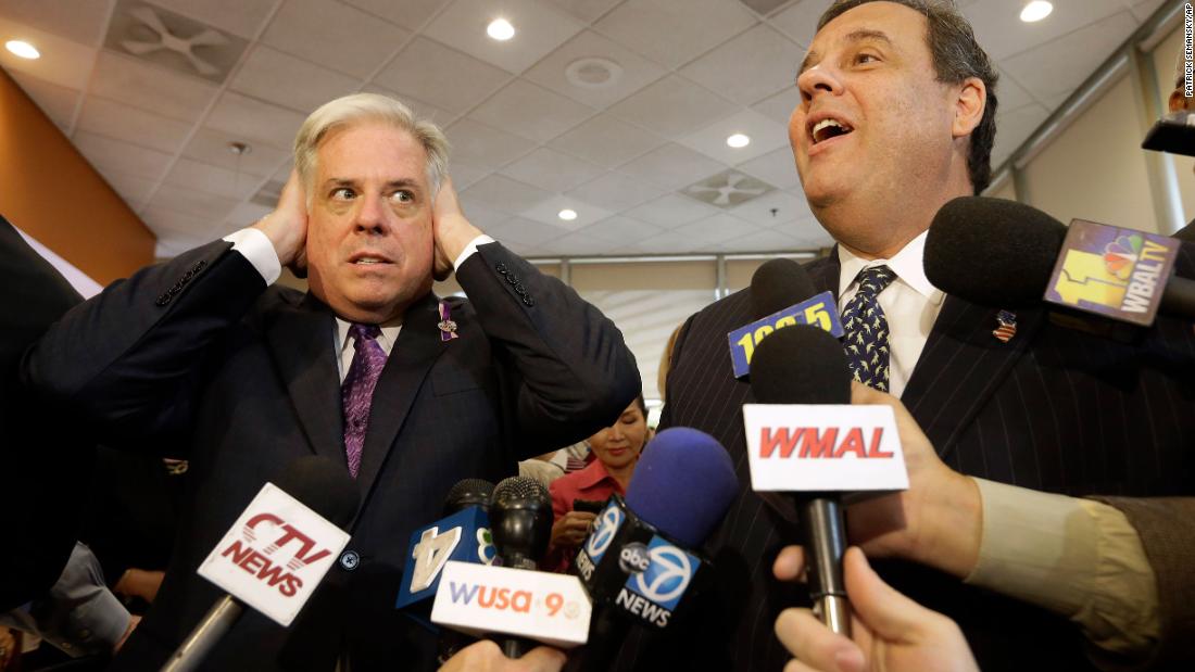 Larry Hogan, who at the time was running for governor of Maryland, pretends not to hear Christie as he speaks to reporters in Bethesda, Maryland, in October 2014. Christie, as head of the Republican Governors Association, was in Maryland to help Hogan&#39;s campaign.